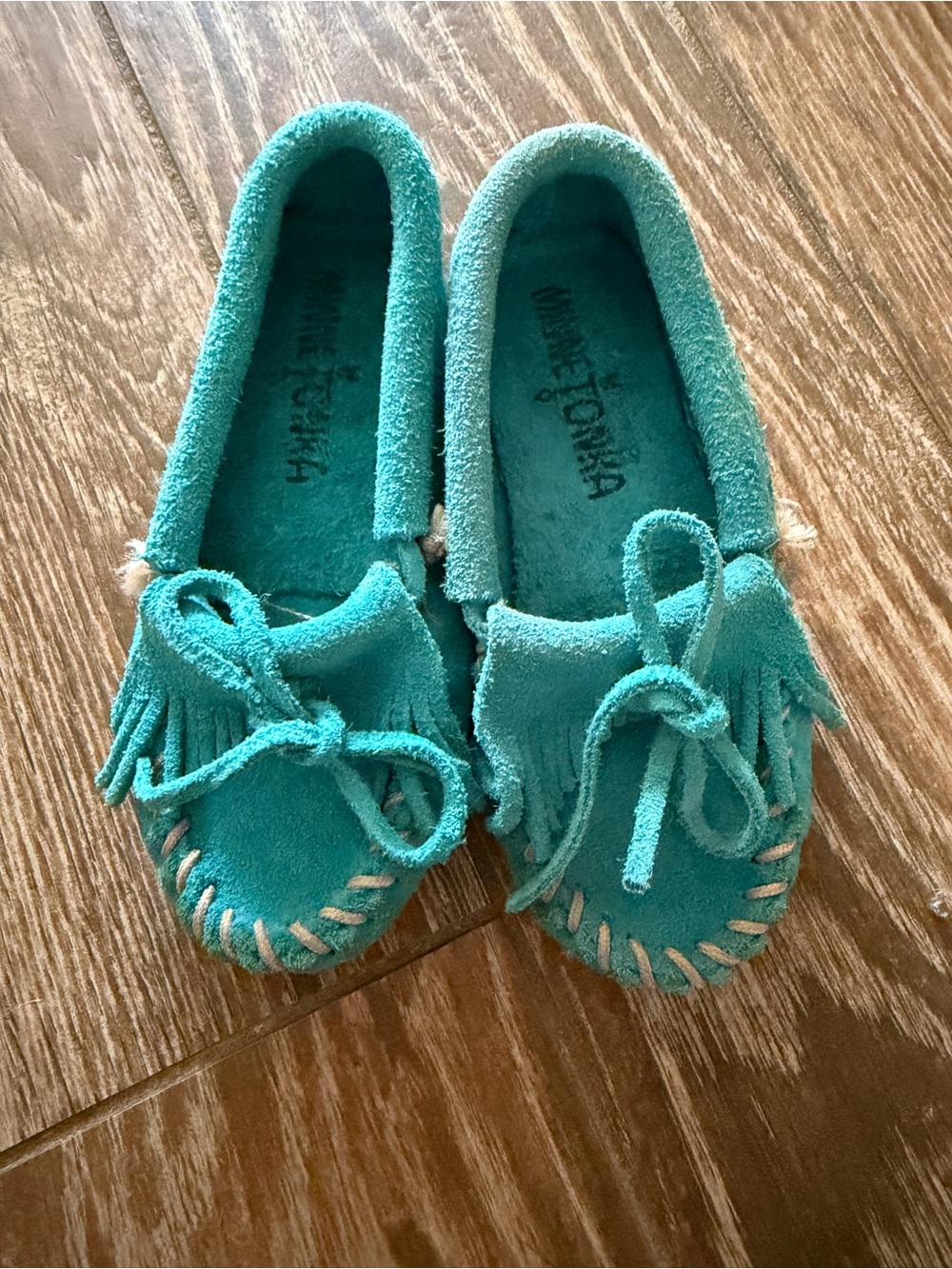 Kids Minnetonka turquoise moccasins 9